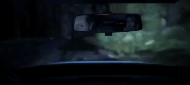 Selene adjusting the rear-view mirror away from Helios